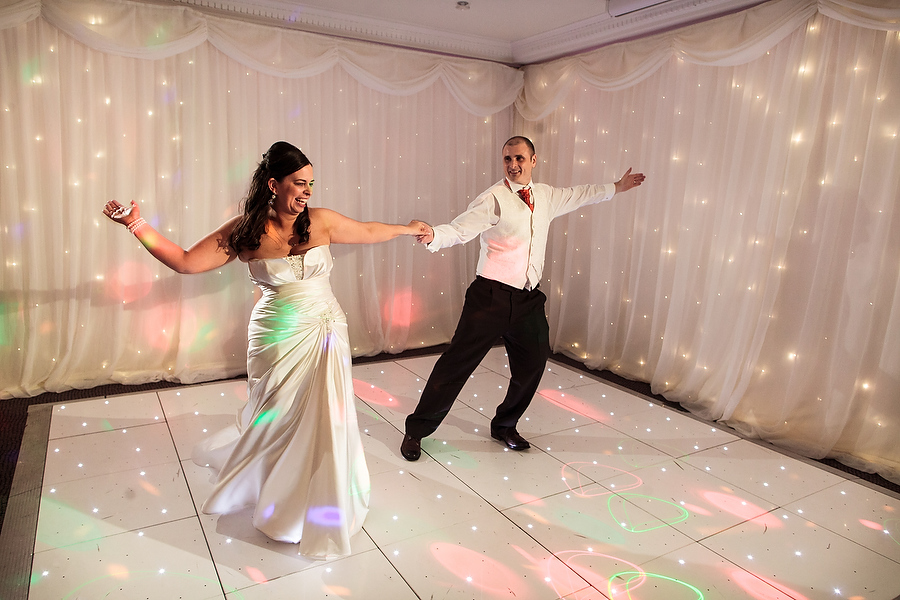 Fun photo during bride and grooms first dance at Moat House in Acton Trussell by Stafford Contemporary Wedding Photographer Barry James