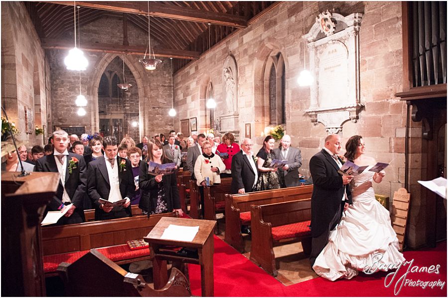 Creative natural wedding photography at St James Church in Acton Trussell by Staffordshire Wedding Photographer Barry James during wedding blessing.