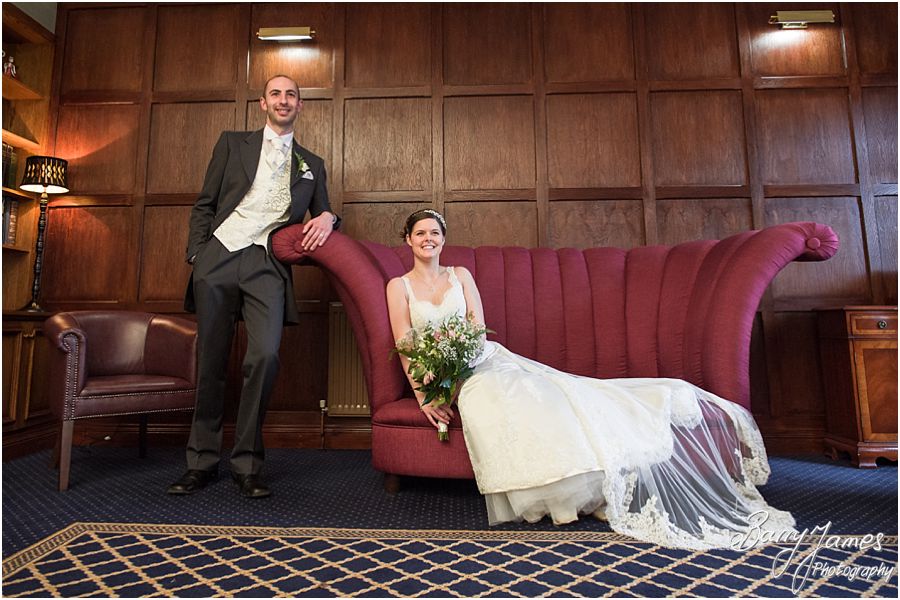 Beautiful photographs of the Bride and Groom inside the newly refurbished Library at The Moat House in Acton Trussell by Stafford Wedding Photographer Barry James