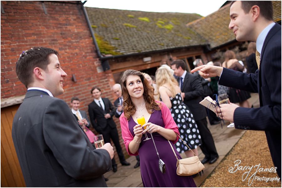 Guests enjoying drinks reception greeting couple at Packington Moor in Lichfield by Lichfield Wedding Photographer Barry James