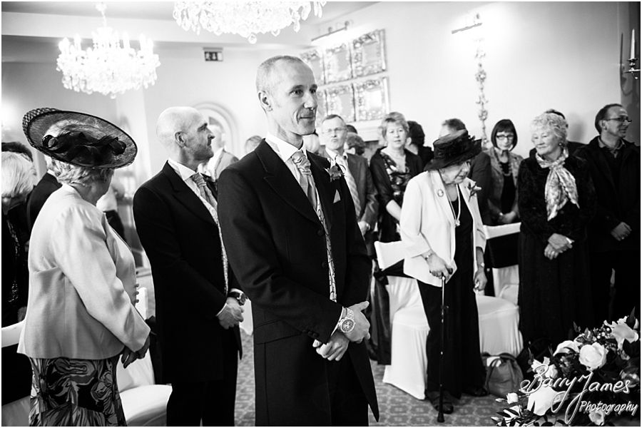Reportage photographs during wedding ceremony in Shrewsbury Suite at Weston Hall in Stafford by Recommended Staffordshire Wedding Photographer Barry James