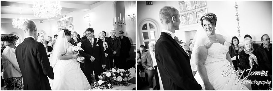 Unobtrusive photographs of wedding ceremony in Shrewsbury Suite at Weston Hall in Stafford by Recommended Staffordshire Wedding Photographer Barry James