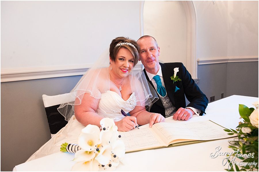 Unobtrusive photographs of wedding ceremony in Shrewsbury Suite at Weston Hall in Stafford by Recommended Staffordshire Wedding Photographer Barry James