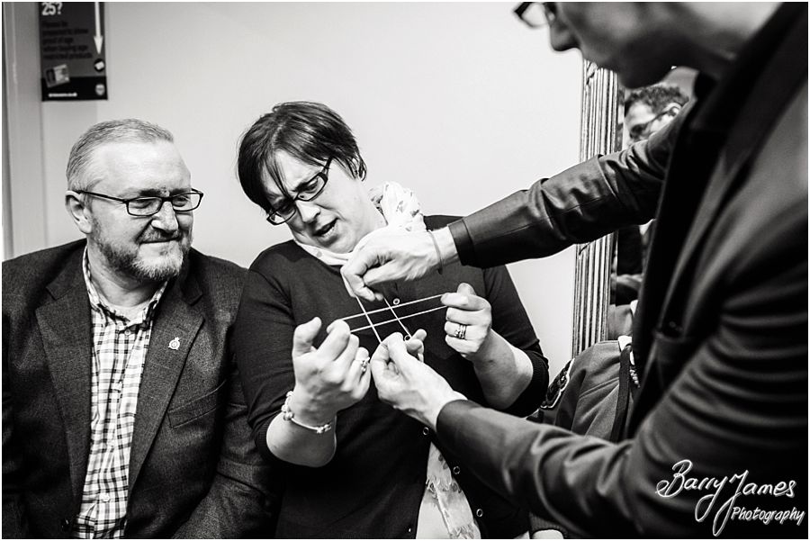 Chris Peskett Magician entertaining the wedding guests at Alrewas Hayes in Burton upon Trent by Contemporary and Candid Wedding Photographer Barry James