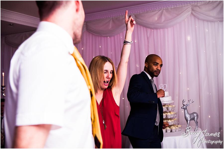 Candid photographs capturing the fun of the wedding reception at The Moat House in Acton Trussell by Wolverhampton Wedding Photographer Barry James