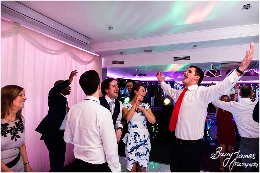 Creative candid photos of the wedding guests enjoying the reception at The Moat House in Acton Trussell by Wolverhampton Wedding Photographer Barry James