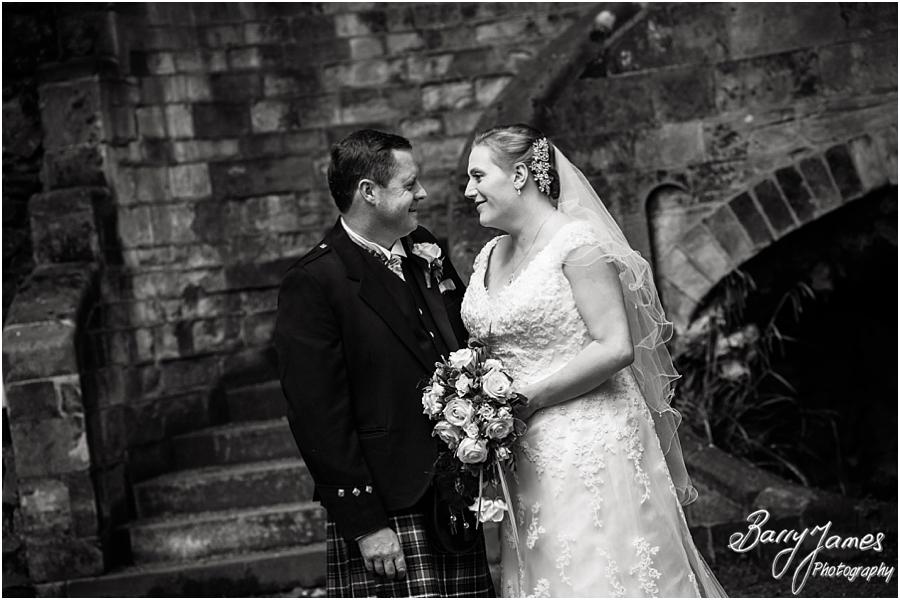 Contemporary portraits of the bride and groom in the beautiful gardens at Moor Hall in Sutton Coldfield by Sutton Coldfield Wedding Photographer Barry James