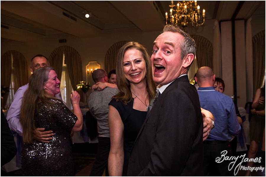 Creative candid photographs that show the fun of the evening reception at Moor Hall in Sutton Coldfield by Sutton Coldfield Wedding Photographer Barry James
