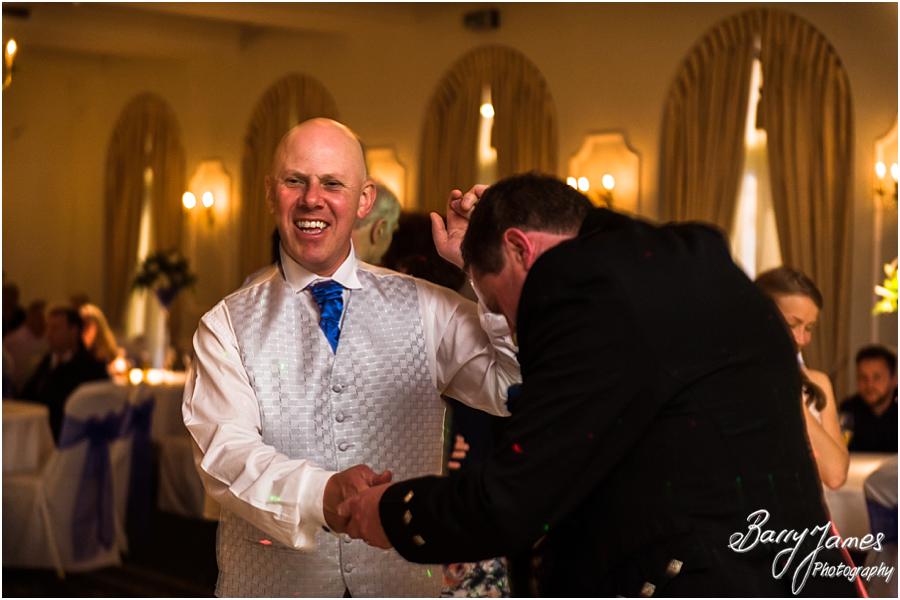 Creative candid photographs that show the fun of the evening reception at Moor Hall in Sutton Coldfield by Sutton Coldfield Wedding Photographer Barry James