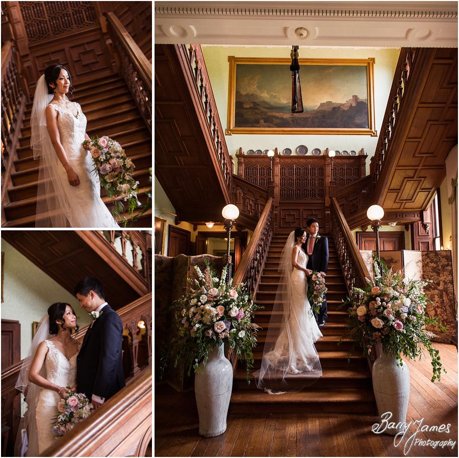 Creative portraits on the grand staircase at Sandon Hall in Stafford by Stafford Wedding Photographer Barry James