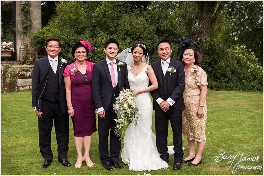 Relaxed family group photographs in the gardens at Sandon Hall in Stafford by Stafford Wedding Photographer Barry James