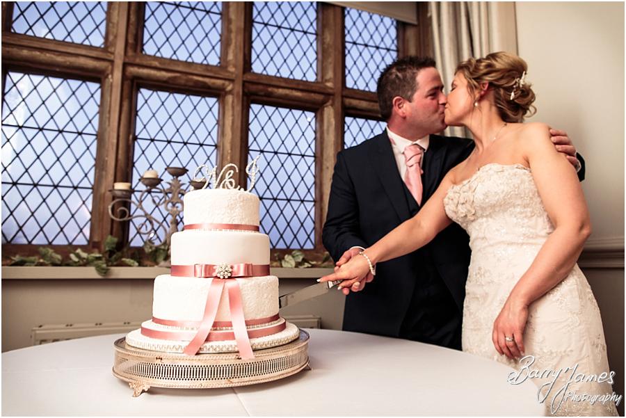Cake cutting fun at Weston Hall in Stafford by Stafford Wedding Photographer Barry James
