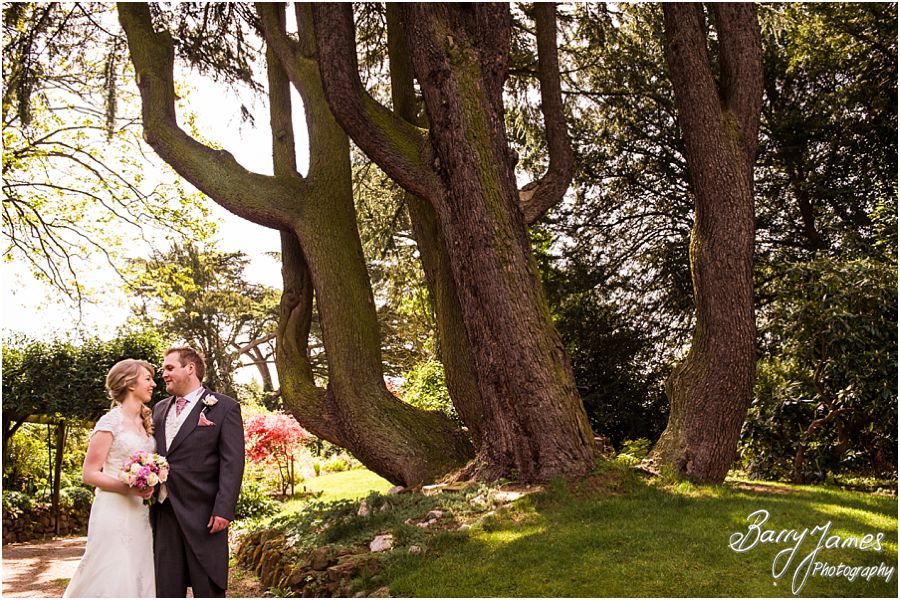 Relaxed portraits of the Bride and Groom in the beautiful grounds at Hawkesyard Hall in Rugeley by Rugeley Professional Wedding Photographer Barry James