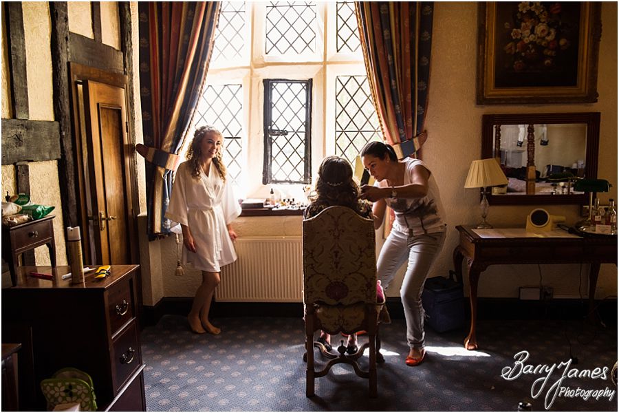Relaxed morning photographs of bridal preparations at Albright Hussey Manor in Shrewsbury by Candid Wedding Photographer Barry James