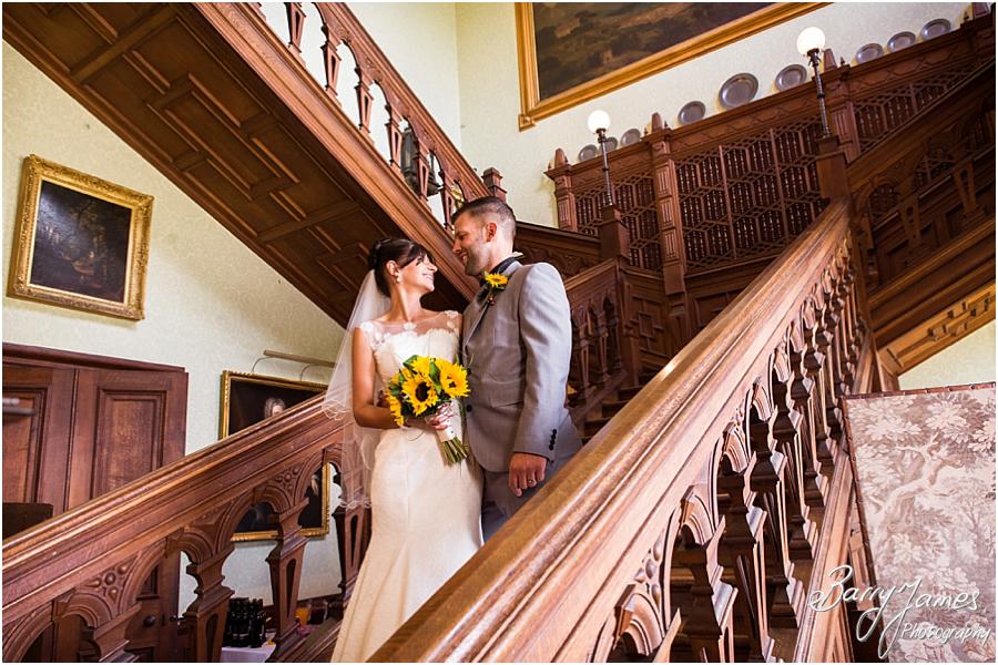 Creative portraits on the beautiful staircase at Sandon Hall in Stafford by Stafford Wedding Photographer Barry James