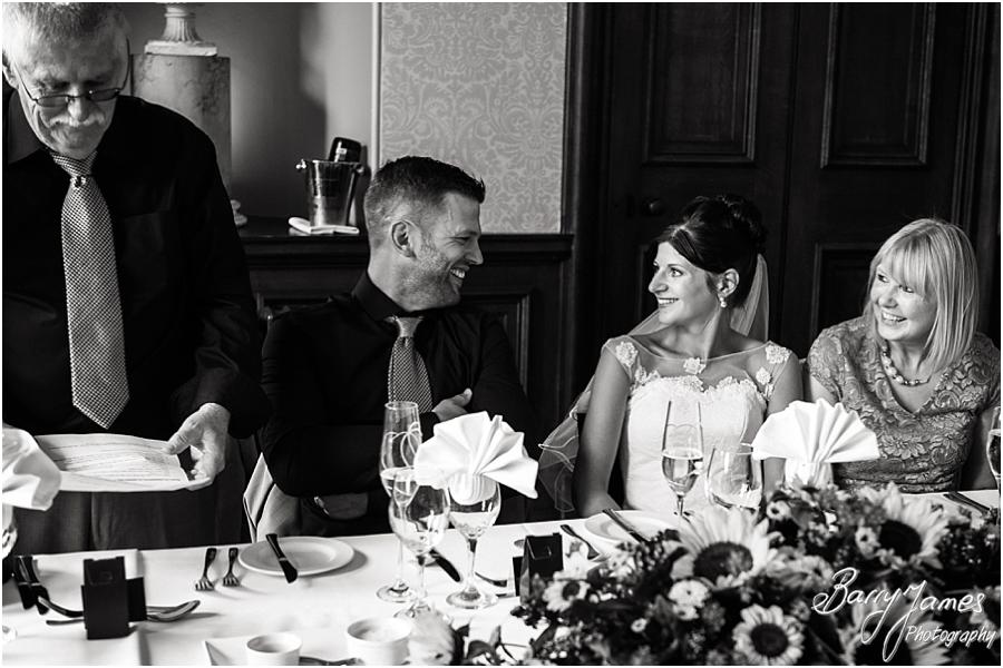 Creative candid photographs that capture the Father of the Bride's speech perfectly at Sandon Hall in Stafford by Stafford Wedding Photographer Barry James