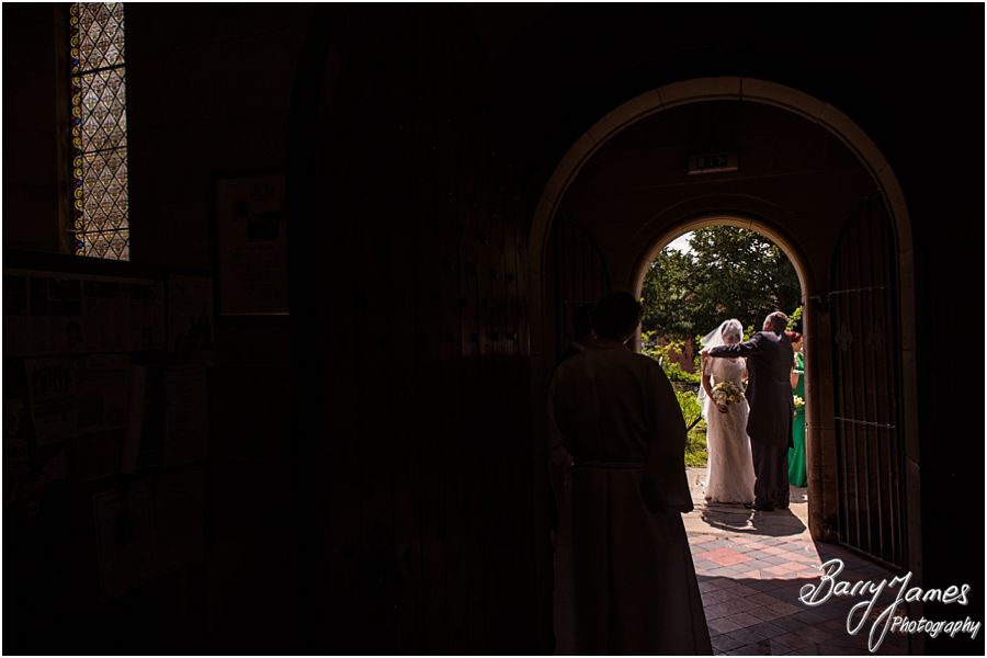 Beautiful photographs of the emotional entrance of the bride at St John the Baptist in Armitage by Rugeley Wedding Photographer Barry James
