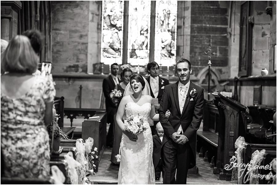 Unobtrusive photographers capturing the wedding ceremony at St John the Baptist in Armitage by Rugeley Wedding Photographer Barry James
