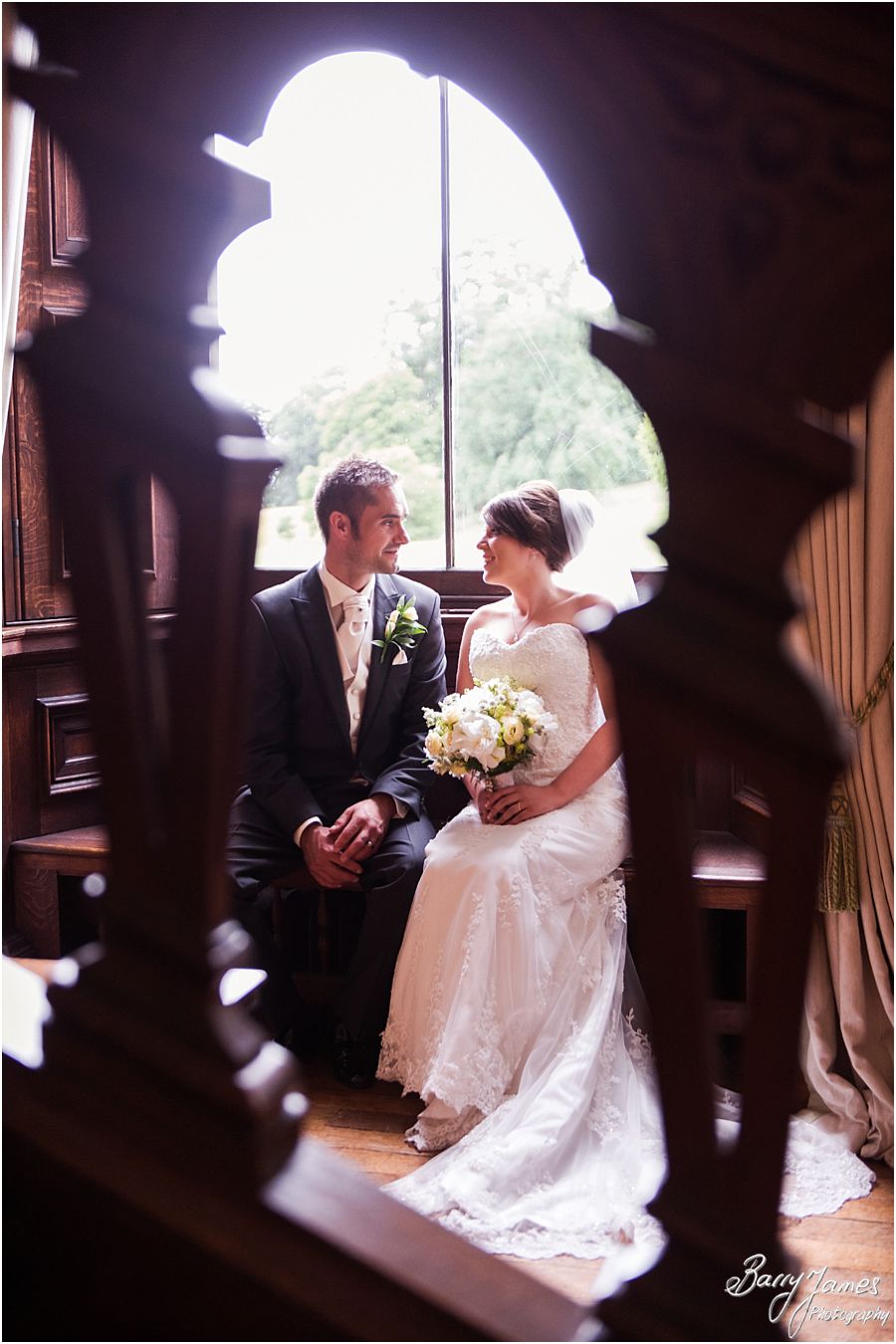 Timeless portraits on the staircase at Sandon Hall in Staffordshire by Recommended Wedding Photographer Barry James