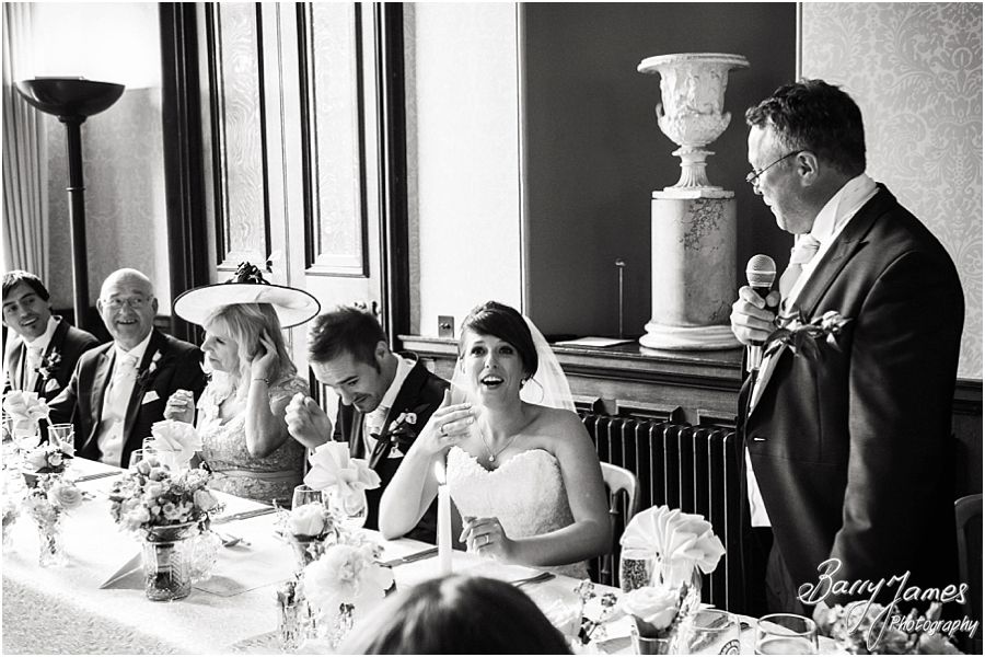 Candid photos of the Father of the Brides speech with wonderful reactions from the bridal party at Sandon Hall in Staffordshire by Recommended Wedding Photographer Barry James