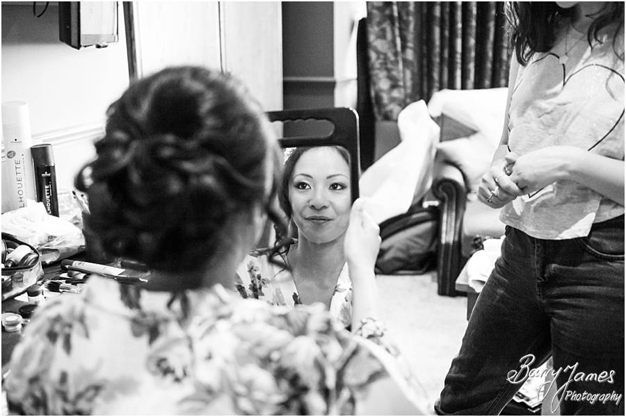 Creative candid photos of the bridal preparation before the wedding at Sandon Hall in Stafford by Stafford Wedding Photographer Barry James
