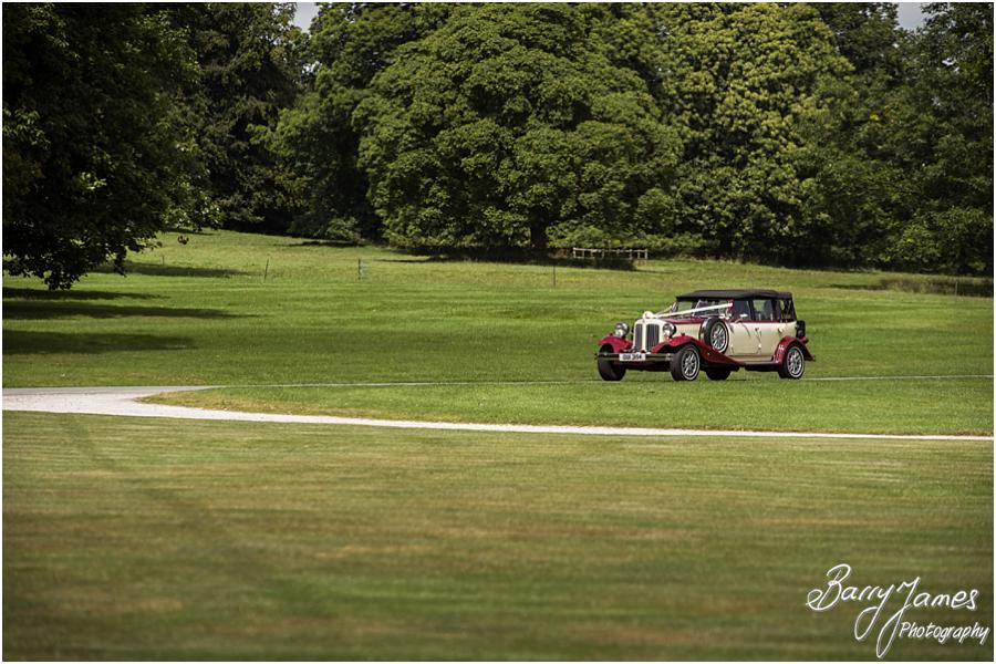 Capturing the arrival of the bridesmaids in the beautiful wedding cars at Sandon Hall in Stafford by Stafford Wedding Photographer Barry James