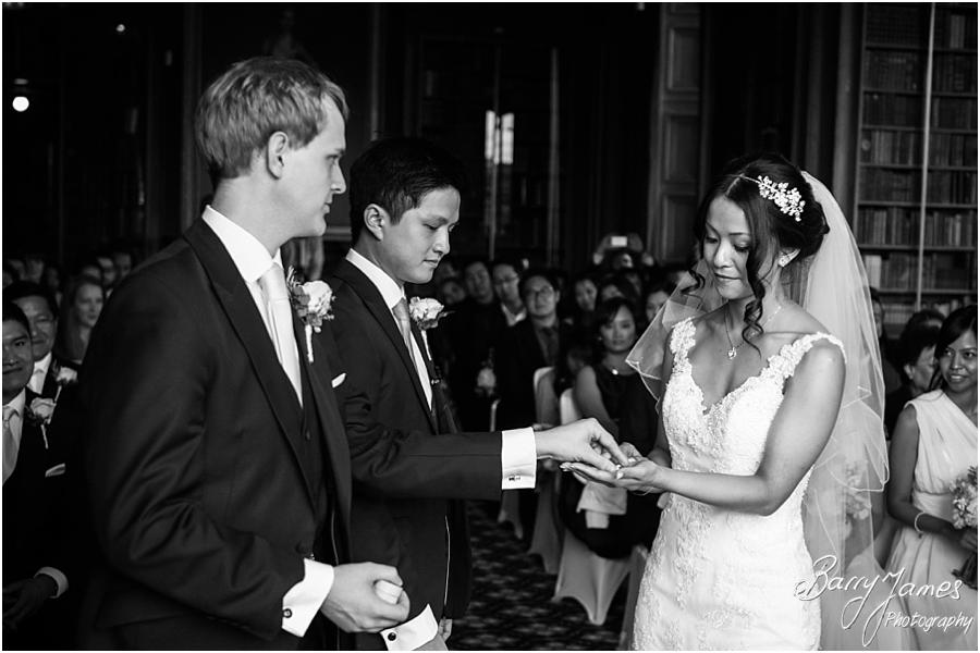 Two photographs covering the wedding ceremony in the library, candidly capturing the story of the wedding at Sandon Hall in Stafford by Stafford Wedding Photographer Barry James
