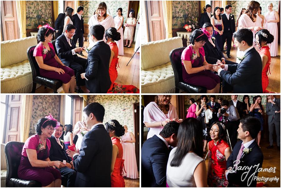 Creative candid photographs of the Chinese tea ceremony at Sandon Hall in Stafford by Stafford Wedding Photographer Barry James