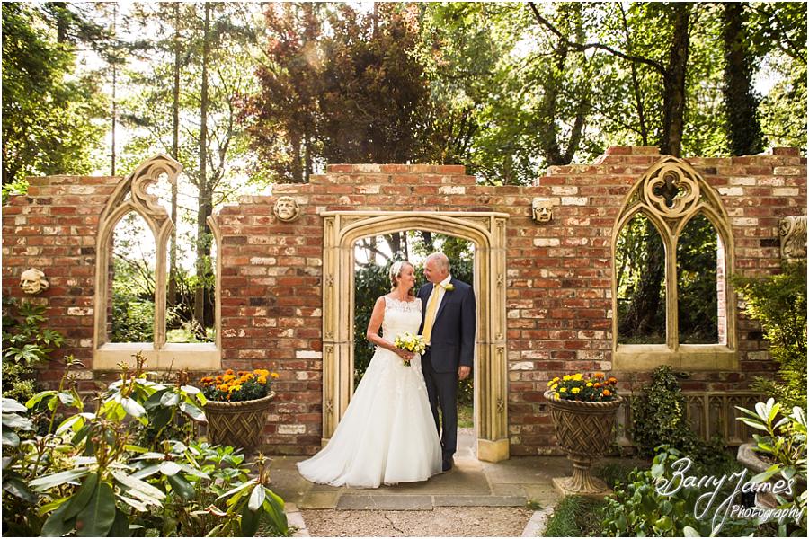 Elegant and natural photographs of the Bride and Groom in the garden at Moxhull Hall in Sutton Coldfield by Sutton Coldfield Wedding Photographer Barry James