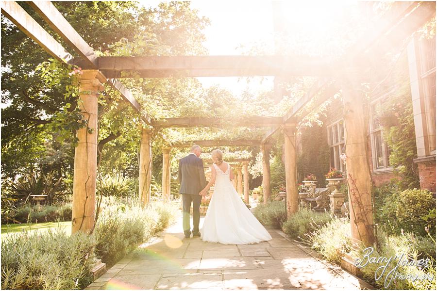 Elegant and natural photographs of the Bride and Groom in the garden at Moxhull Hall in Sutton Coldfield by Sutton Coldfield Wedding Photographer Barry James