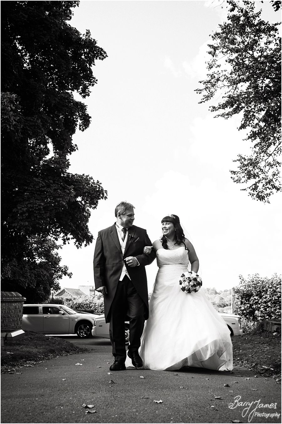 Bride and father arrival in Rolls Royce Limousine at Rushall Parish Church in Walsall by Walsall Wedding Photographer Barry James