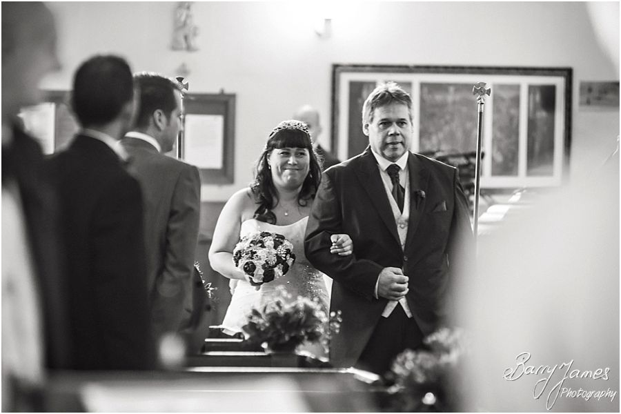Unobtrusive photographs of the Bridal entrance to her waiting groom at Rushall Parish Church in Walsall by Walsall Wedding Photographer Barry James