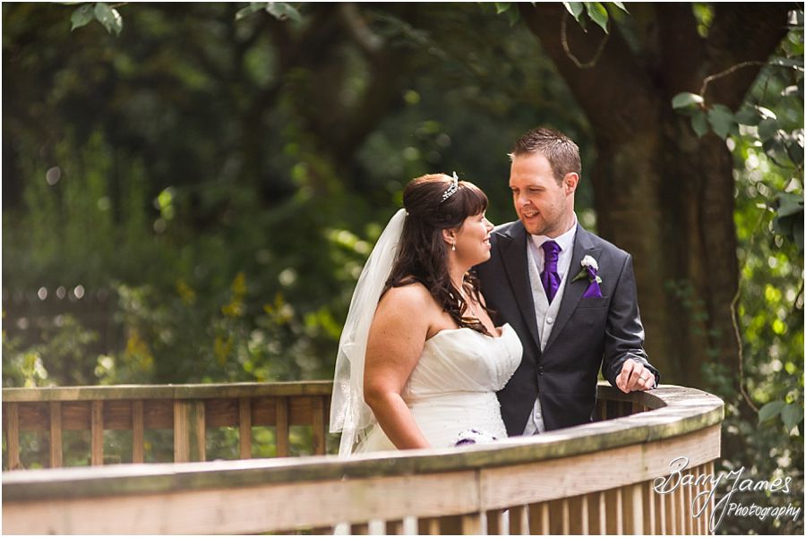 Stylish and creative portraits of the Bride and Groom on the lake at Walsall Arboretum in Walsall by Walsall Wedding Photographer Barry James