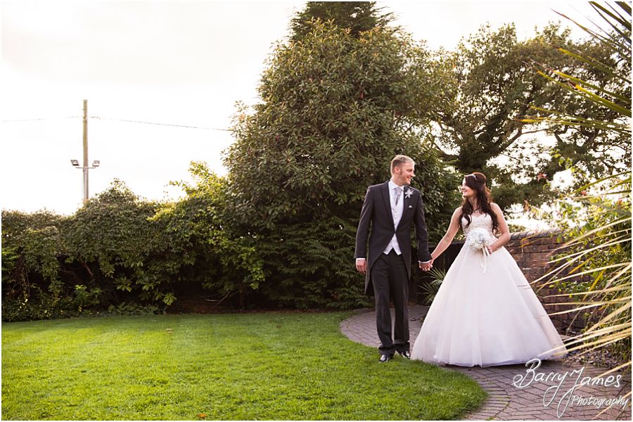 Relaxed contemporary portraits of the Bride and Groom in the lovely gardens at Oak Farm in Cannock by Cannock Wedding Photographer Barry James