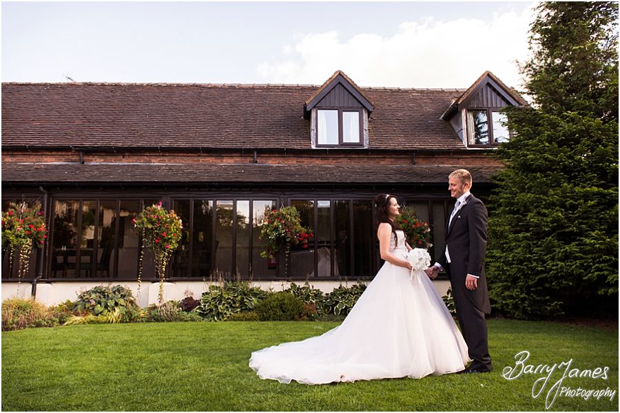 Relaxed contemporary portraits of the Bride and Groom in the lovely gardens at Oak Farm in Cannock by Cannock Wedding Photographer Barry James
