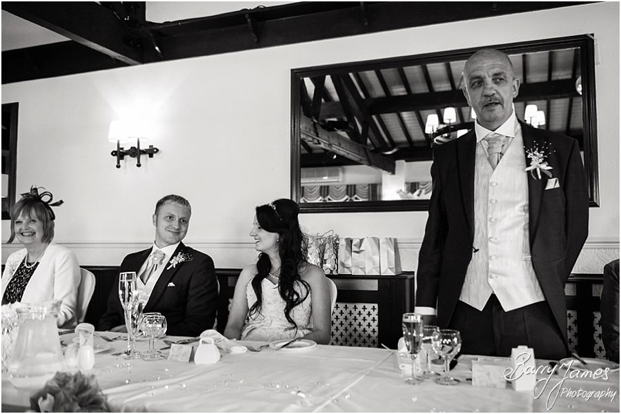 Creative candid photographs capturing the reaction to the Father of the Bride speech at Oak Farm in Cannock by Cannock Wedding Photographer Barry James