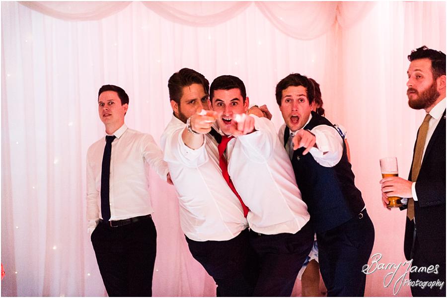 Candid photographs capturing the fun of the wedding reception at The Moat House in Acton Trussell by Wolverhampton Wedding Photographer Barry James